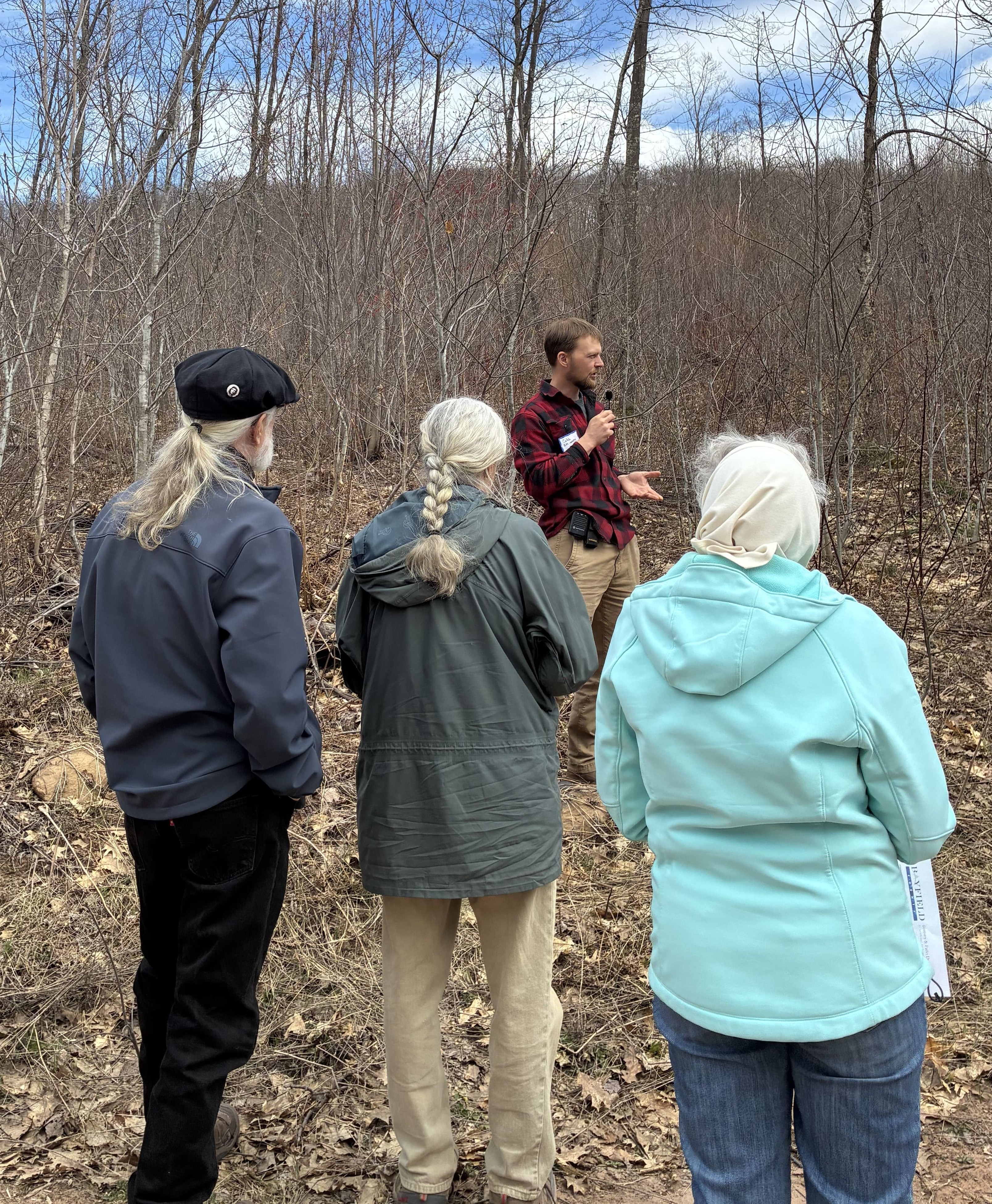 County Forester Caleb Brown explaining timber stand improvement practices in the Bayfield County Forest