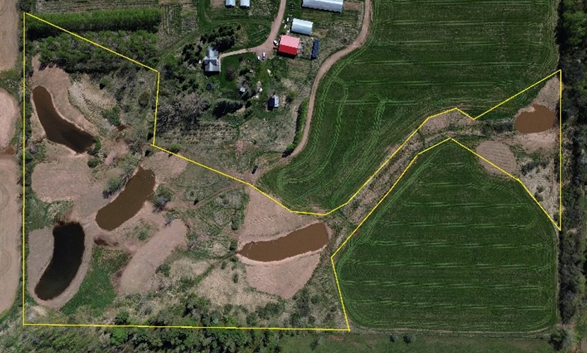 Aerial view of wetland scrapes at Fischbach Wetland showing shallow depressions designed to capture runoff and slow water movement
