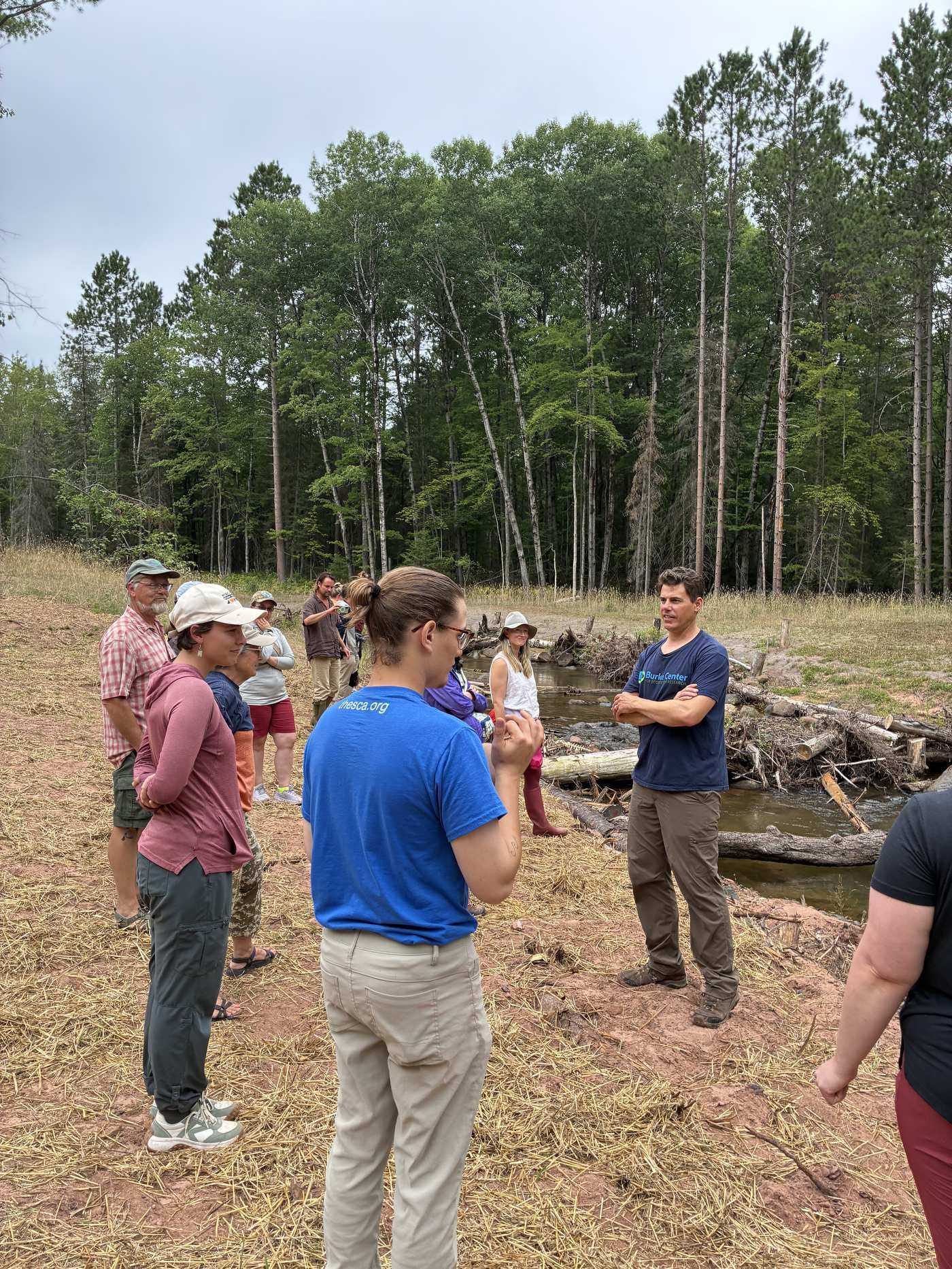 Matt Hudson leading a discussion at the Keystone Bluff Restoration Site along Fish Creek