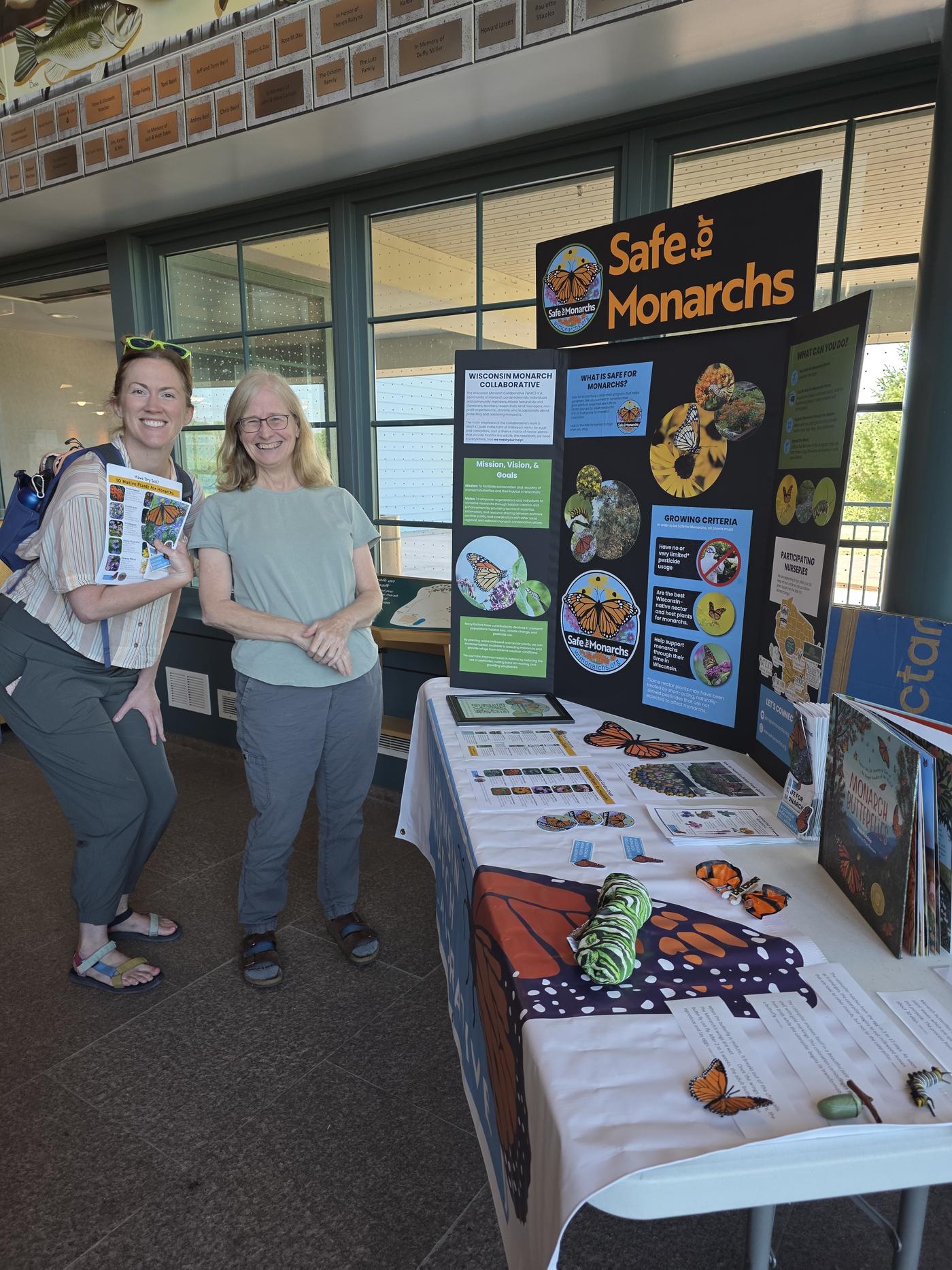 Staffing an outreach table on monarchs and the Safe for Monarchs program at the Northern Great Lakes Visitor Center
