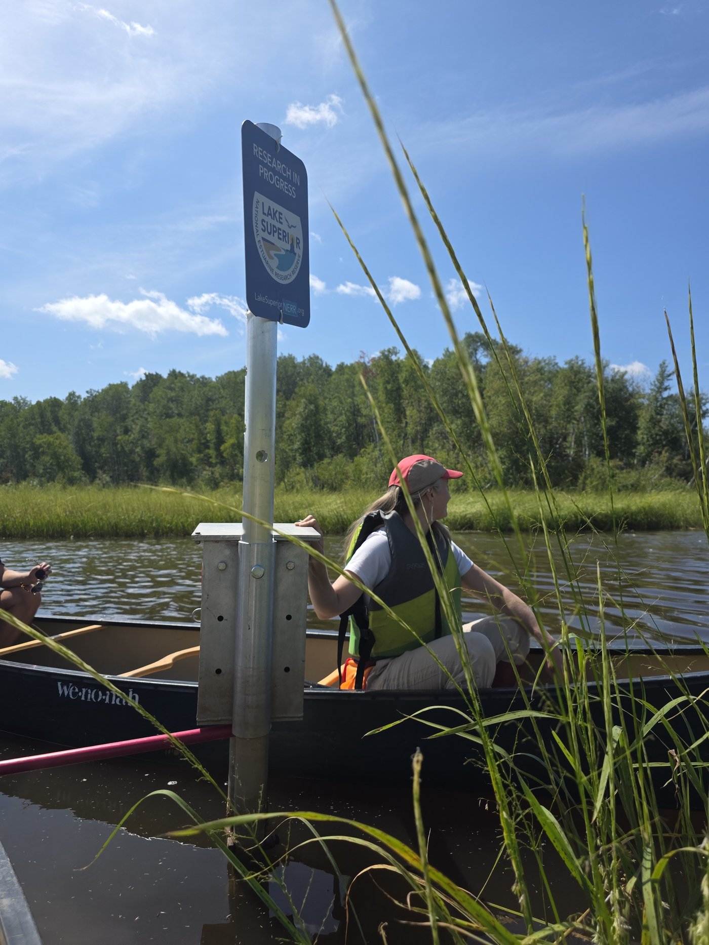 Paddling Pokegama Bay to check the climate monitoring station