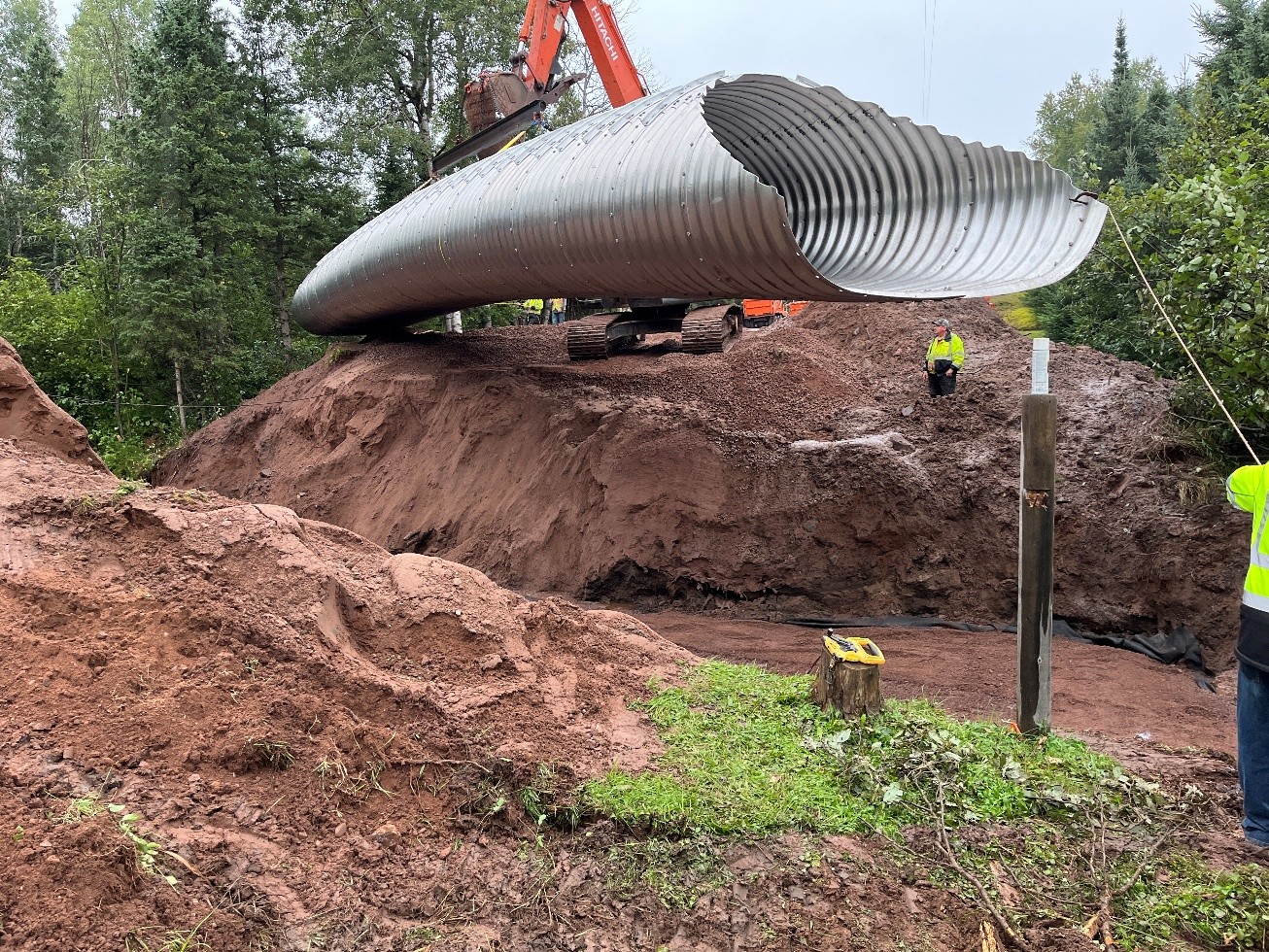 Excavator removing failed culvert from road at Happy Creek