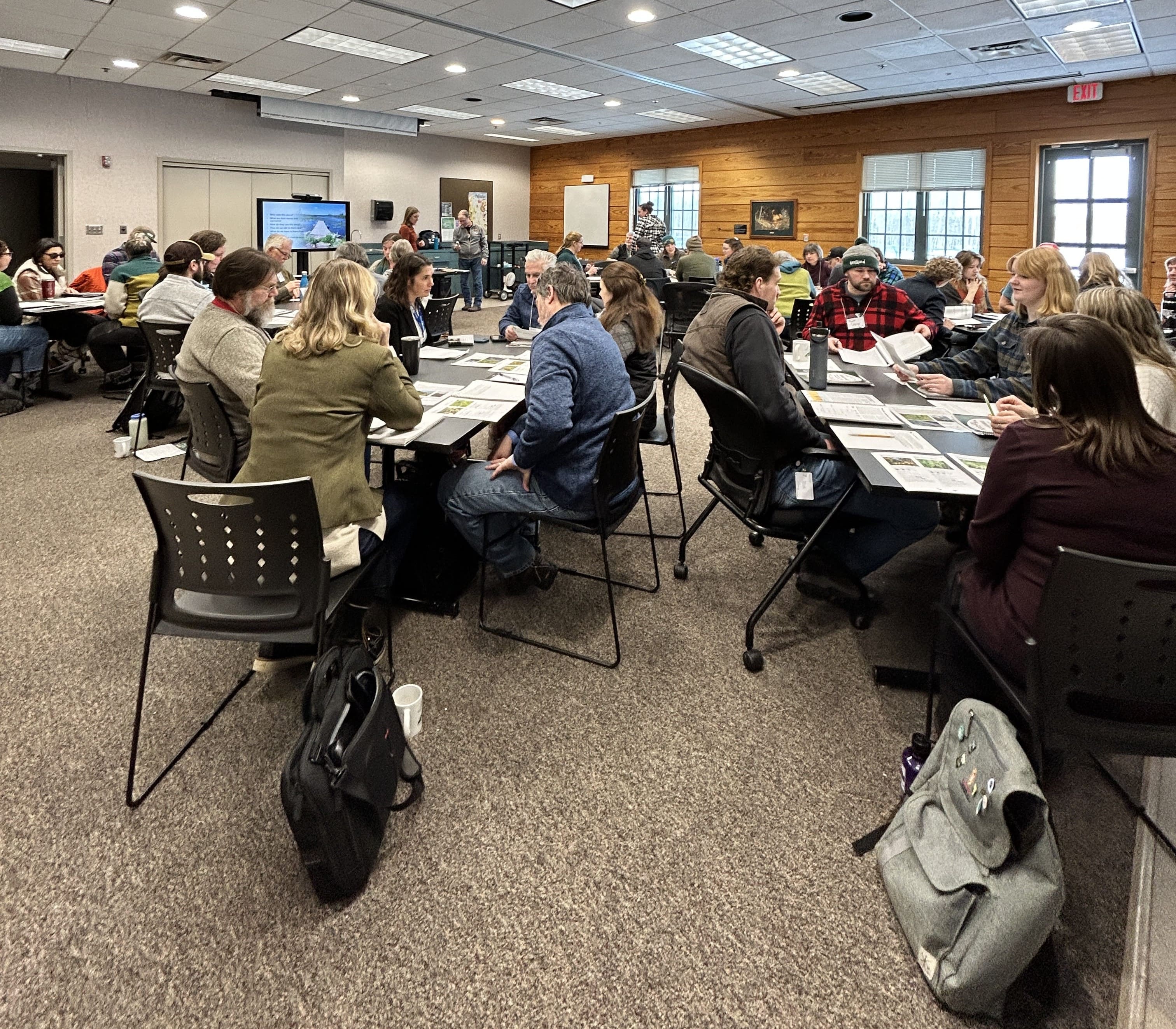 Symposium participants engaged in small group work during a workshop at the 2026 LSC Symposium